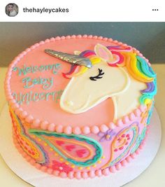 a birthday cake decorated with an unicorn face