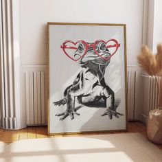 a drawing of a frog with heart shaped glasses on it's face, sitting in front of a radiator