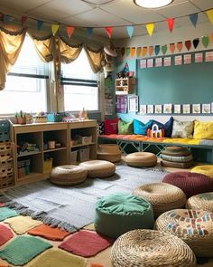 a room filled with lots of different colored pillows