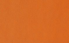 an orange textured leather background