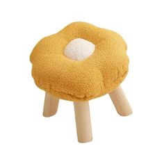 a small stool made out of wood with a yellow and white cushion on the top