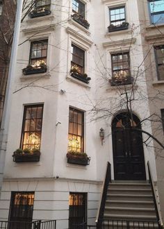 an apartment building with many windows and stairs