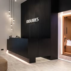 a reception area with black and white walls