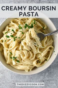 creamy bourssin pasta in a white bowl with a spoon