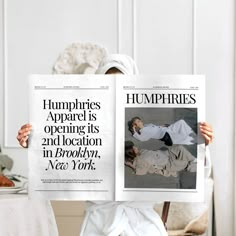 a person holding up two newspapers with the same image on them, one reading humphries apparel is opening its 2nd location in brooklyn, new york