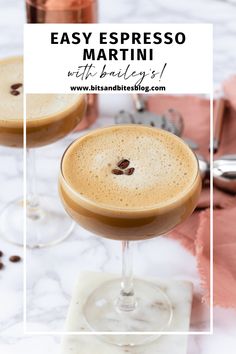 two glasses filled with espresso martinis on top of a marble countertop