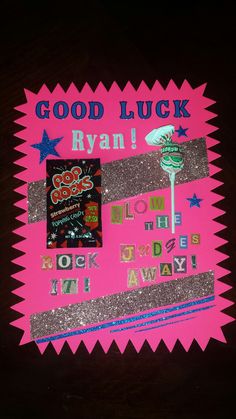 a pink sign that says good luck ryan and some other things on it's side