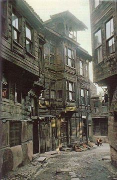 an old city street with lots of wooden buildings