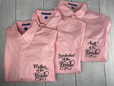 three pink shirts with embroidered sayings on them