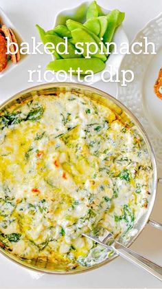 baked spinach ricotta dip in a pan with bread and vegetables on the side