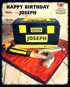 a birthday cake made to look like a toolbox with tools on it and the words, happy birthday joseph