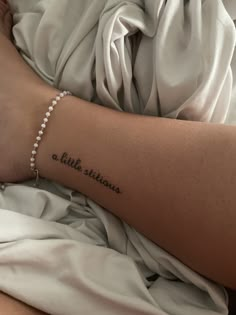 a woman's arm with a tattoo that reads, little stories on the side