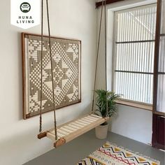 a living room with a swing and rug on the floor