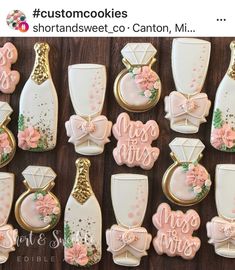 decorated cookies are arranged in rows on a wooden table with the words congratulations written across them