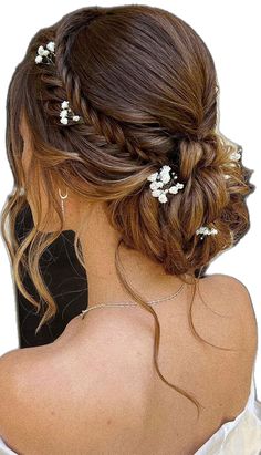 the back of a woman's head with white flowers in her hair, wearing a wedding dress