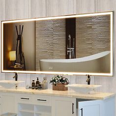 a bathroom with two sinks and a large mirror on the wall above it that has a reflection of a bathtub