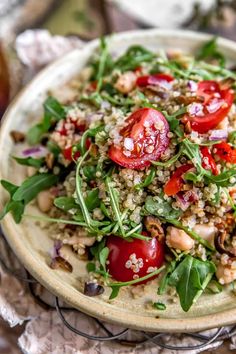 a salad with tomatoes and other vegetables on a plate