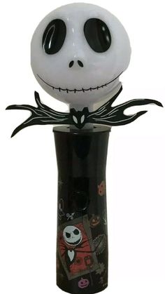 a black and white vase with a skeleton on it's head in the shape of a jack skellingy