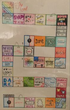 a white board with many different colored squares on it and words written in the middle