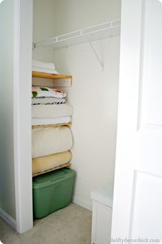 the closet is full of folded towels and other things to use as storage for clothes