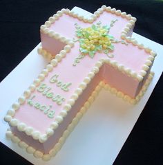 a cake shaped like a cross on top of a white plate