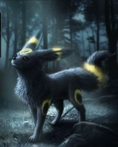 a black and yellow furry animal standing in the woods at night with bright lights on it's ears