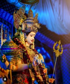 a woman dressed in an elaborately decorated costume