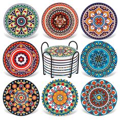 six colorful plates with designs on them and one has a metal holder in the middle