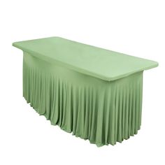 a green table with a long pleated skirt on the top and bottom, sitting in front of a white background