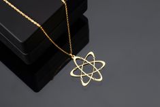 "Atomic symbol jewelry is a great way to show off your love of science and express your unique personality. Our atomic symbol jewelry is made with 925K silver and is available in a variety of styles, so you can find the perfect piece to match your look. Whether you're a chemist, physicist, or simply a science enthusiast, our atomic symbol jewelry is a great way to show your passion for the field. It's also a great way to start a conversation about your favorite element or scientific concept. ✨ HOW TO ORDER: 1️⃣ Select your desired finish. 2️⃣ Pick a necklace length from 14\" to 22\". 3️⃣ Add to your cart and proceed to checkout. 🚚 SHIPPING: Experience joy as your necklace arrives in a beautiful gift box. Plus, enjoy FREE SHIPPING on all orders. 🔄 RETURNS AND EXCHANGES: We're committed to Math Jewelry, Atomic Symbol, Science Wedding, Chemistry Jewelry, Symbol Jewelry, Jelly Wallpaper, Science Jewelry, Element Symbols, Symbol Necklace