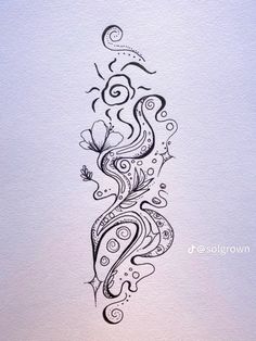 an artistic tattoo design with swirls and flowers on the back of a white paper