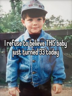 a young boy wearing a denim jacket and hat with the words i refuse to believe this baby