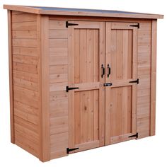 a large wooden storage shed with two doors