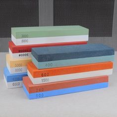 five books stacked on top of each other with numbers written on them in different colors