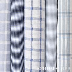 several different plaid fabrics are lined up next to each other, all in blue and white