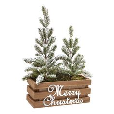 a wooden planter filled with pine trees and merry christmas written in white lettering on the side