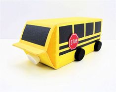 a yellow school bus shaped box with a stop sign on it