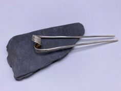 "The inspiration for this item comes from traditional Thai hairpin that women used to wear for special occasions, such as Thai festivals, Thai dance or weddings.  It is made of a single solid silver piece, hammered to create textures in the middle part, that is twisted and folded into the final shape of the hairpin. Simple yet sophisticated, you can use it as an everyday detail as well as that \"something special\" piece to make your hairdo stand out." Silver Wire Rings, Silver Hair Pin, Silver Silk, Silver Gift Wrap, Silver Earrings Handmade, Silver Gifts, Women Supporting Women, Silver Pieces, Silver Hair