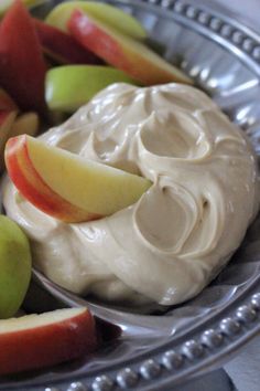 apples and whipped cream in a metal bowl