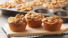 some muffins are sitting on a cutting board