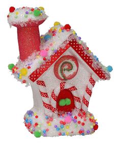 a christmas decoration with a house and candy canes