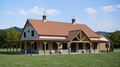 a large building with two towers on top of it's roof in the middle of a field