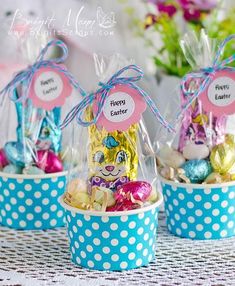 three baskets filled with candy and candies on top of a table