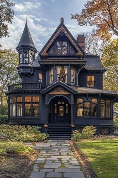 an old victorian style house in the fall