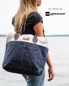 Chebeague is the largest island in Casco Bay, but you won't find a movie theater, sports bar or grand hotel on this quiet, unspoiled oasis. It's a highlight for anyone cruising Maine's coast. Inspired by our island neighbor, the Chebeague collection is handsome and rugged. Our Tote is designed with premium leather handles, Dacron sailcloth with navy canvas bottom and embossed leather Sea Bags logo patch. Perfect Travel Outfit, Travel Collection, Leather Handles