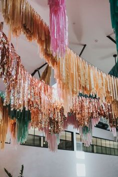 colorful streamers hanging from the ceiling in a building