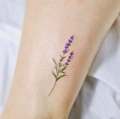 small lavender flower tattoo on the ankle