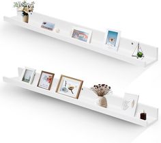 two white shelves with pictures and vases on each shelf, one has flowers in it