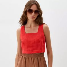 Exude summer vibes with this sleeveless top, perfect for those warm days and balmy nights. Crafted with impeccable attention to detail, our linen crop top is the embodiment of modern elegance. The square neck design brings a touch of sophistication, while the back buttons add a dash of vintage charm. Made from premium quality linen, this top ensures you stay cool and comfortable all day long. Whether you're off to a brunch or a beach outing, this sleeveless beauty pairs seamlessly with skirts, jeans, or shorts. Elevate your summer wardrobe with this essential, versatile piece. * Made from washed European blend linen (60% linen and 40% cotton) * OEKO-TEX certified fabric (no harmful chemicals used in production) * From XS to Plus size * Perfect choice for summer TAKING CARE: * machine wash Chic Linen Crop Top For Vacation, Chic Cotton Tank Top For Vacation, Chic Cami Tank Top For Beach Season, Chic Linen Crop Top For Spring, Summer Sleeveless Blouse Crop Top For Beach, Summer Sleeveless Crop Top For Beach, Sleeveless Linen Tank Top For Summer, Chic Crop Top Tank Top For Vacation, Linen Tops For Beach Season Vacation