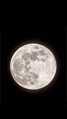 the full moon is seen in the dark night sky with no clouds on it's side